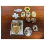 Assorted Costume Jewelry Lot Including Heart Locket, Brooches, and Clip-On Earrings