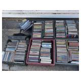 Large Assortment of CDs, DVDs, Blu-rays, and Philips Player