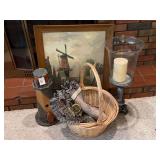 Home Decor Assortment Including Lighthouse Figure, Woven Basket, Glass Candle Holder, Framed Artwork, and Leather Strap with Brass Hames