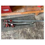 Assorted Pipe Clamps and Metal Pipes