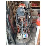 Shop Setup with Campbell Hausfeld Air Compressor, Bench Grinder on Stand, and Extension Cords