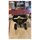 (2) Lawn Seeders - 1 push, 1 handheld caster