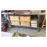 Work bench with wood top, crates of hardware