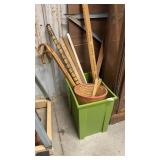 Bin of vintage yardsticks, canes, rulers