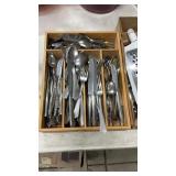 Container Full Of Kitchen Flatware