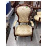 Antique high back chair with casters