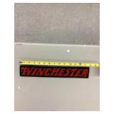 Winchester cast iron sign
