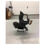 Cast iron saxophone playing rooster