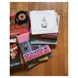 Assorted Music Media Collection: Vinyl Records, Cassette Tapes, and More