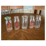 Assorted Clear Glass Advertising Milk Bottles