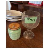 Two Glass Vessels: Green Jar with Lid and Clear Glass Goblet