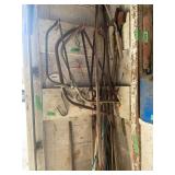 Lot of Hand Saws, Hedge Shears, Fishing Poles, and Garden Tools