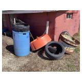 Assorted Plastic and Metal Containers with Vehicle Tires