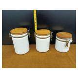 Set of Three White Canisters with Wooden Lids