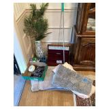 Assorted Household Items Including Rugs, Cleaning Supplies, Decorative Plant, and More