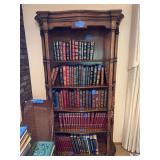 Wooden Bookshelf with Assorted Literature and Reference Volumes