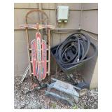 Assorted Outdoor Equipment Lot: Silver Streak Sled, Agri-Fab Spreader, and Metal Animal Trap