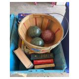 Assorted Books and Bocce Ball Set in Wooden Basket
