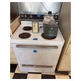 General Electric Electric Range with Assorted Kitchen Items