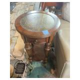 Round Wooden Accent Table with Drawer and Ornate Metal Top