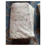 Floral Embroidered Quilt with Pink Blossoms and Green Stems