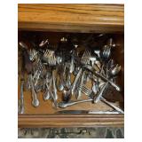 Large Collection of Silverplate Flatware with Decorative Scroll Handles