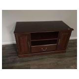 Dark Wood Entertainment Center with Storage Cabinets and Lower Drawer