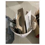Bucket of Assorted Masonry Floats and Trowels