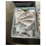 Assorted Linens in Plastic Storage Bin