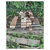 Assorted Red and Brown Bricks and Pavers on Pallets