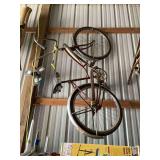 Two Bicycles Including Red Cruiser and Purple Model