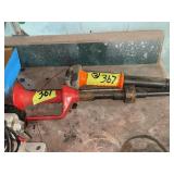 Two Powder-Actuated Hand Tools with Orange and Red Handles