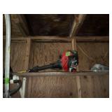 Red and Black Gas Powered String Trimmer