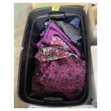 Black Plastic Storage Tote Filled with Assorted Apparel
