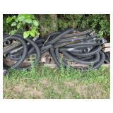 Corrugated Plastic Drainage Pipe Lot with Pallets and Lumber