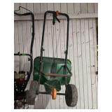 Green Push Spreader with Black Frame and Wheels