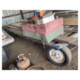 Stacked Pink and Green Insulation Boards Alongside Heavy Timber Beams