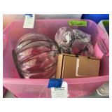 Pink Plastic Tote Containing Halloween Decor and Glassware