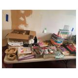 Large Assortment of Sewing and Craft Supplies Including Fabric, Ribbons, Books, and Tools