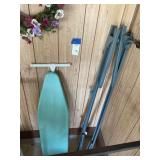 Wall-Mounted Ironing Board with Metal Framework and Floral Wreath