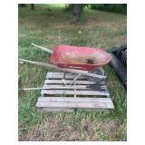 Wheel Barrow and Rake