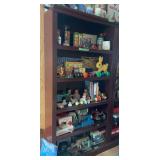 Wooden Bookshelf Displaying Assorted Collectible Toys, Dolls, and Miniature Sewing Machines