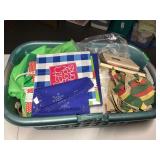 Mixed Lot of Craft Supplies, Holiday Decor, and Textiles in Laundry Basket