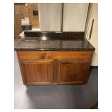 Wooden Base Cabinet with Dark Faux Stone Laminate Countertop