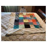 Handmade Patchwork Quilt with Multi-Colored Squares and Border