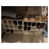 Closet Lot with Storage Cubbies, Rolling Suitcase, Plastic Bin, Shoes, and Slippers