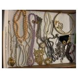 Assorted Costume Jewelry Lot Including Necklaces, Pendants, and Bracelets