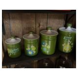 Four-Piece Green Ceramic Canister Set with Floral Motif and Lids