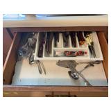 Assorted Kitchen Contents Including Flatware, Linens, Dinnerware, and Drinkware