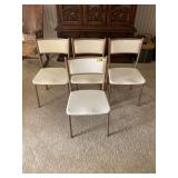 Set of Four Metal Folding Chairs with Cream Vinyl Upholstery